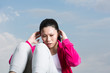 Chinese woman doing situps in park.