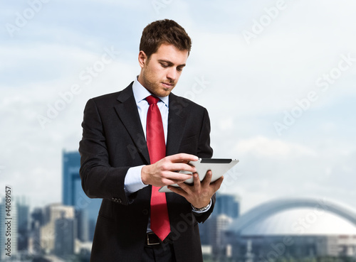 Photo: Businessman using a tablet Businessman using a tablet