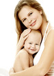 Young mother hugging baby