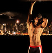 Sexy stud at night in the city
