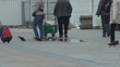 People with pigeons in Market Square, Old Town,Krakow, Poland