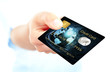 closeup of blue credit card holded by hand