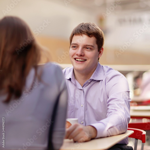 Photo: young couple in cafe young couple in cafe