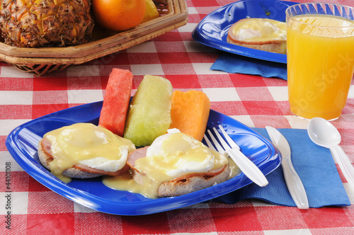 Photo: Eggs Benedict with fresh melon slices Eggs Benedict with fresh melon slices
