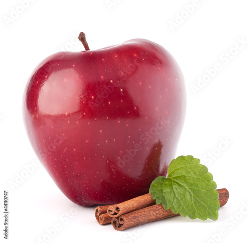 Photo: Red apple, cinnamon sticks and mint leaves still life Red apple, cinnamon sticks and mint leaves still life