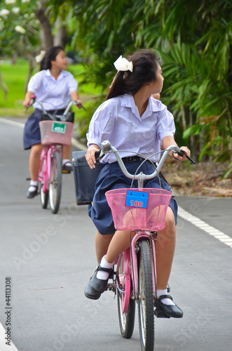 Photo: Thai Schoolgirl riding a bicycle Thai Schoolgirl riding a bicycle