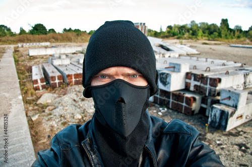 Photo: Concept photo. Thief takes off security camera Concept photo. Thief takes off security camera