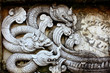 Foto: naga statue on wall of fence naga statue on wall of fence