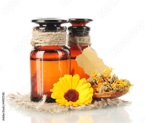 Photo: medicine bottles and calendula, isolated on white medicine bottles and calendula, isolated on white