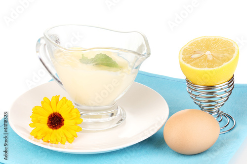 Photo: Mayonnaise in bowl on napkin isolated on white Mayonnaise in bowl on napkin isolated on white