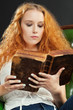 Photo: Reading an old book Reading an old book