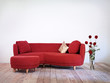 red sofa and vase with red dahlia