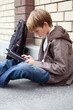 Photo: School teen with electronic tablet sitting School teen with electronic tablet sitting