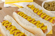 Simple Hot Dogs with yellow mustard and caramelized onions.