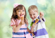 Photo: Children with icecream cone outdoor Children with icecream cone outdoor