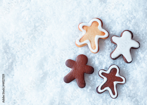 Photo: Christmas gingerbread men on snow Christmas gingerbread men on snow