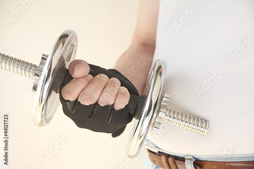 Photo: gloved hand with weight gloved hand with weight