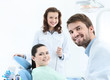 Photo: Dentist, his assistant and the patient Dentist, his assistant and the patient
