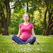 Photo: Beautiful pregnant woman in the park Beautiful pregnant woman in the park