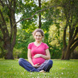 Photo: Beautiful pregnant woman in the park Beautiful pregnant woman in the park