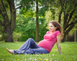 Photo: Beautiful pregnant woman in the park Beautiful pregnant woman in the park