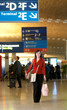 Photo: Beautiful young tourist in the airport Beautiful young tourist in the airport