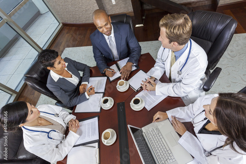 Photo: Interracial Medical Business Team Meeting in Boardroom Interracial Medical Business Team Meeting in Boardroom