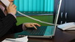 Business woman working at her desk, callphone