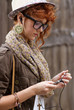 Hipster girl listening to music on mp3 player