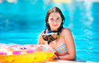 Photo: portrait of happy beautiful teen girl smiling at the pool portrait of happy beautiful teen girl smiling at the pool