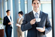 young businessman having coffee break in office