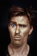 Funny man with golden make-up
