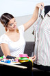 Female Fashion Designer Taking Measurement