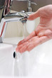 Photo: Washing arm in sink bathroom. Washing arm in sink bathroom.