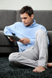 Photo: Relaxed Man Using Digital Tablet Relaxed Man Using Digital Tablet