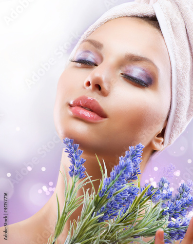 Photo: Spa Girl with Lavender Flowers. Organic Cosmetics Spa Girl with Lavender Flowers. Organic Cosmetics