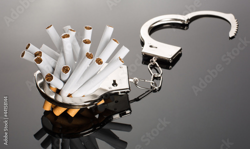Photo: Cigarettes locked to handcuffs Cigarettes locked to handcuffs