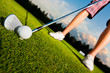 closeup shot of golf ball with golf club right before tee off 