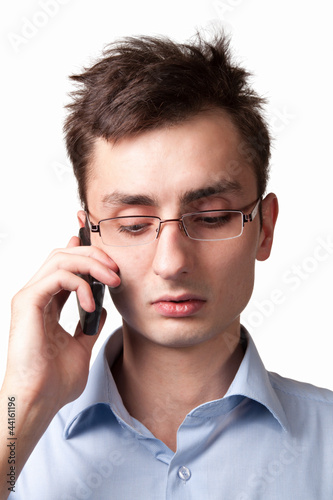 Photo: Young businessman talking on the mobile phone Young businessman talking on the mobile phone