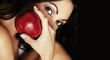 Photo: Mysterious woman holding red apple Mysterious woman holding red apple