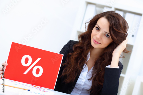 Photo: Young business woman with sale sign Young business woman with sale sign