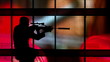 Video: silhouette of a gunman against a colorful background silhouette of a gunman against a colorful background
