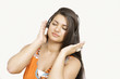 Photo: Pretty girl enjoys music on headphones Pretty girl enjoys music on headphones
