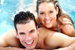 Young couple in jacuzzi.
