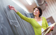 Pretty young elementary school/college teacher writing on the ch