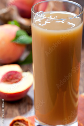 Photo: glass of peach juice glass of peach juice