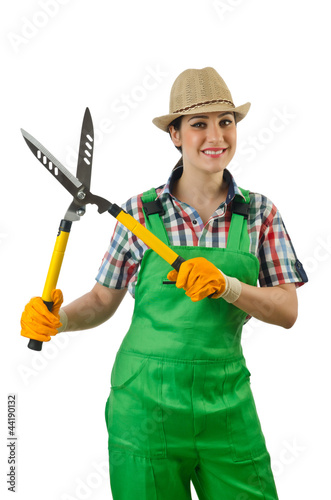 Photo: Girl with garden scissors on white Girl with garden scissors on white