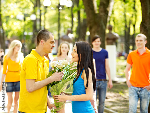 Photo: Couple of people on date outdoor. Couple of people on date outdoor.