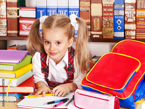 Photo: Child with stack book. Child with stack book.
