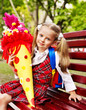 Happy child with school cone.